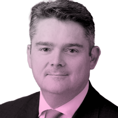 Portrait of a man in a suit and tie, facing forward, with short hair and a neutral expression. The image has a pink color overlay.